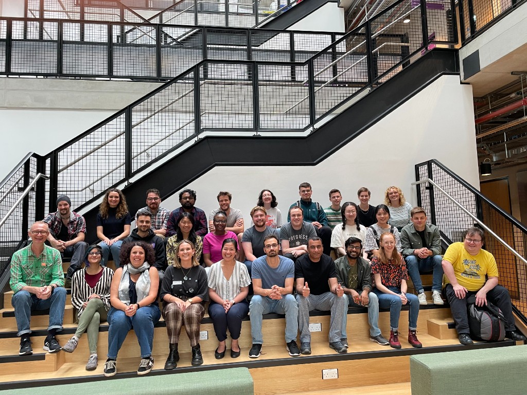 A group of students gather on the steps for an assembly of TECN, the Tyndall Early Career Network of early-career researchers (MPhil, PhD and contract researchers) affiliated with the Tyndall Centre for Climate Change Research