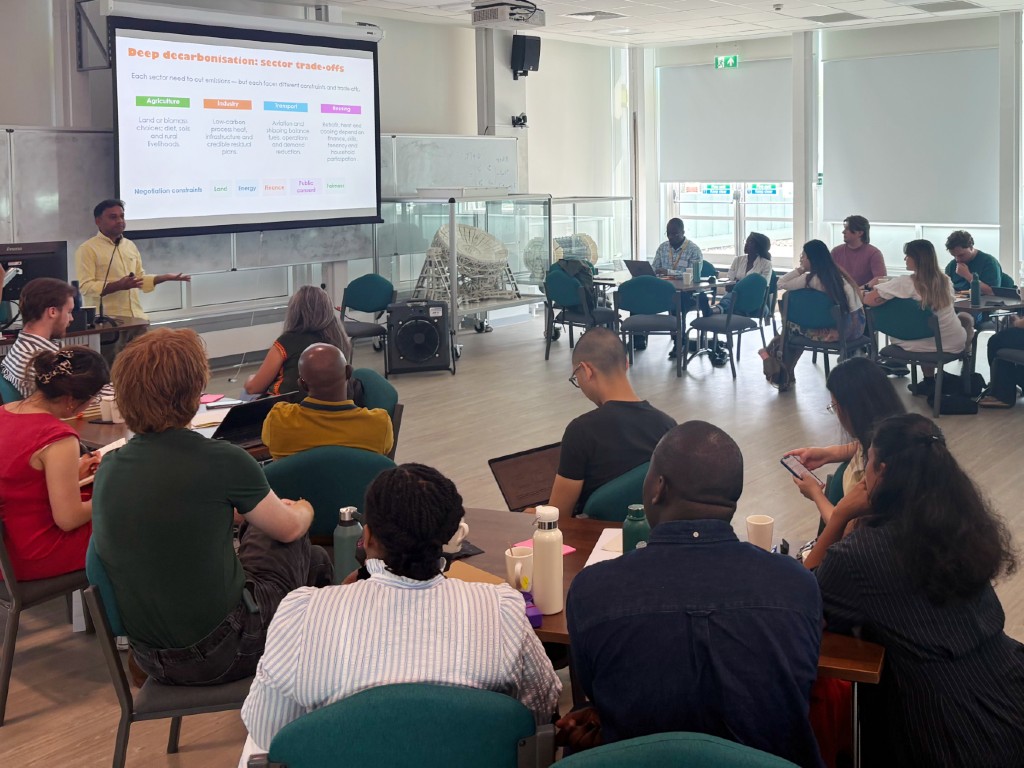 The Tyndall Centre for Climate Change Research: 25 years of impact 5 Some of the Tyndall Early Career Network (TECN) students and researchers, gathered for a summer school at the University of Manchester in 2026 to hear a session on 'Deep decarbonisation: sector trade-offs'.