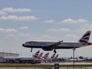 British Airways Airbus A320 landing at Heathrow, London on a clear day.