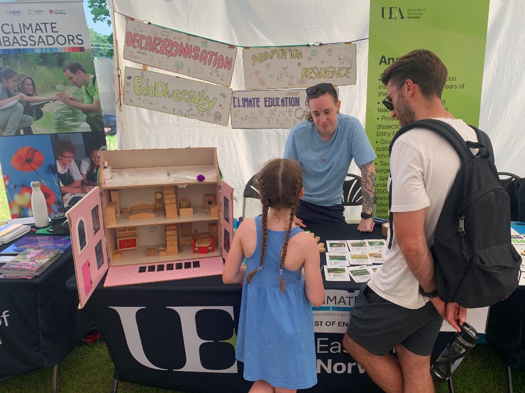 The Tyndall Centre for Climate Change Research: 25 years of impact 4 A girl talks to somebody at the UEA / Climate Ambassadors stall at the Royal Norfolk Show in 2026.